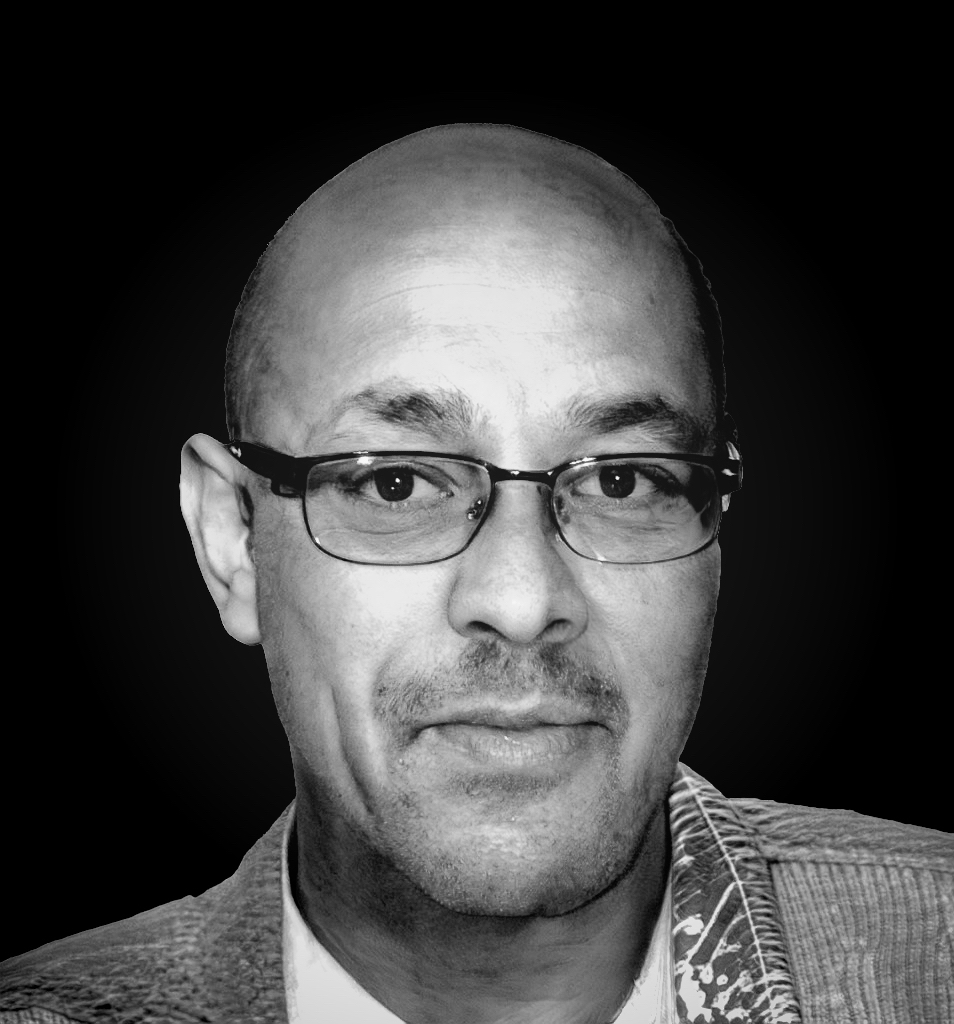 Grano Sales black and white portrait photo.